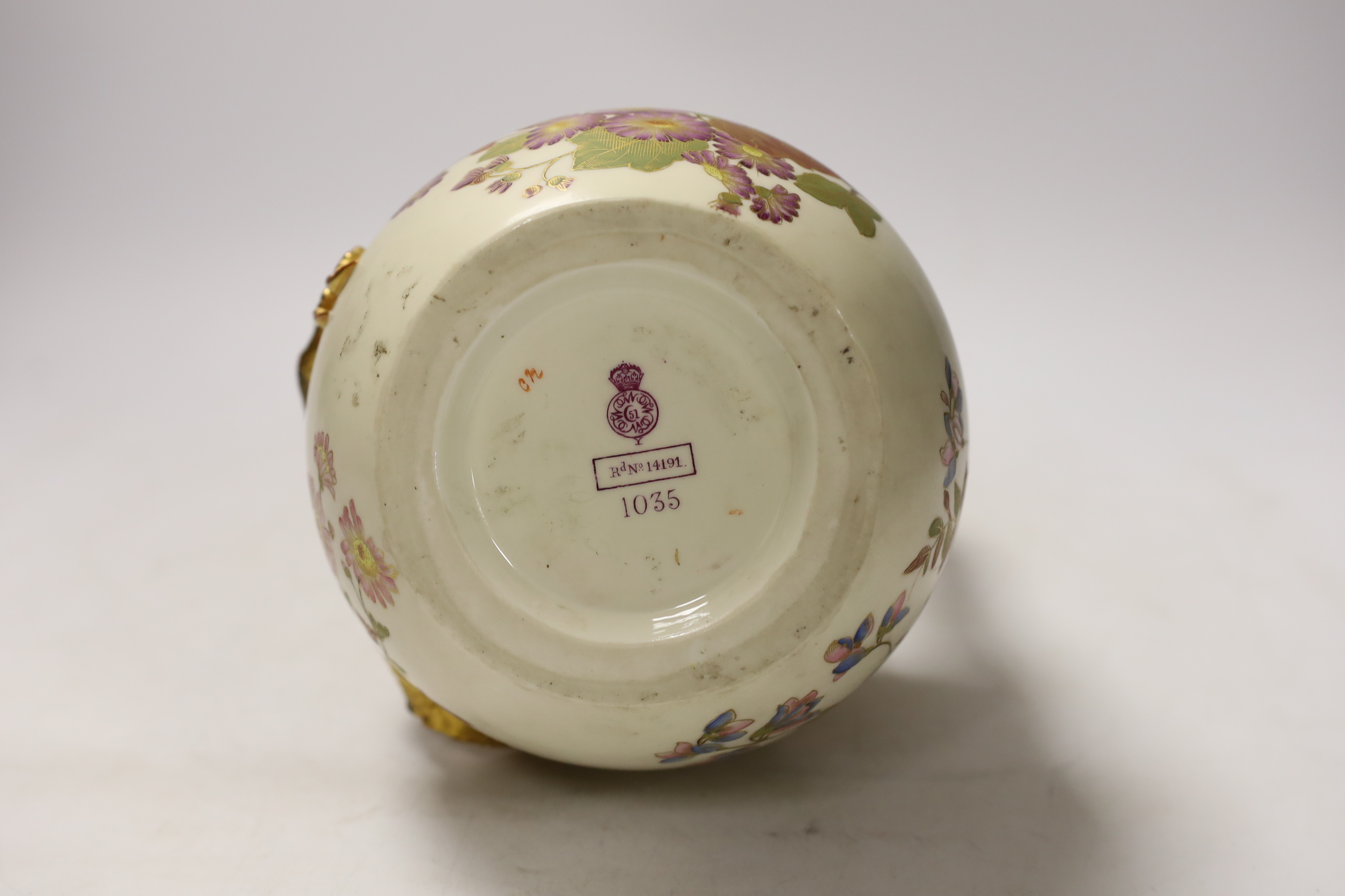 A Royal Worcester ewer with dragon handle, numbered 1035, 29cm high